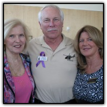 Marty Dickerson, left, smiles with Doug Fox and Courtney Walsh
