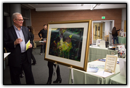 Former Littleton mayor Phil Cernanec viewing Eyvind Earle artwork