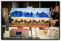 Painting by pancreatic cancer survivor Arturo Garcia on display in the silent auction